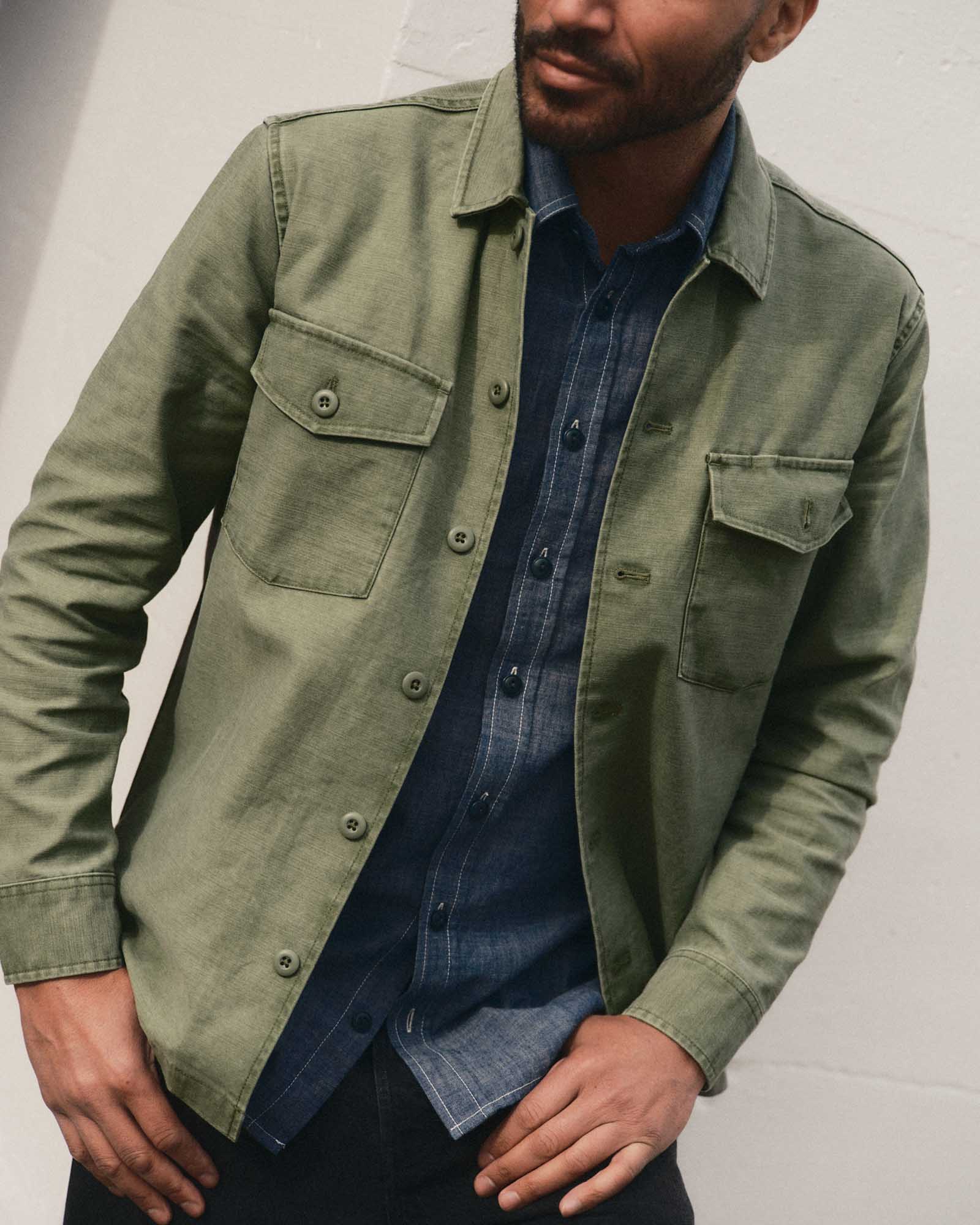 fit model walking wearing The Surplus Shirt in Field Olive Reverse Sateen, Wovens by Taylor Stitch