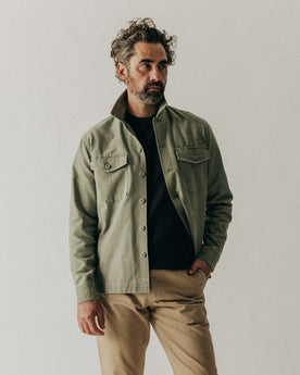 fit model walking wearing The Surplus Shirt in Field Olive Reverse Sateen, Wovens by Taylor Stitch