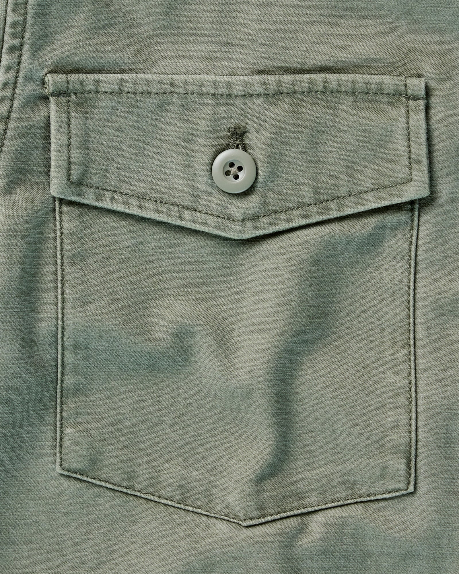 flatlay of the back of The Surplus Shirt in Field Olive Reverse Sateen, Wovens by Taylor Stitch