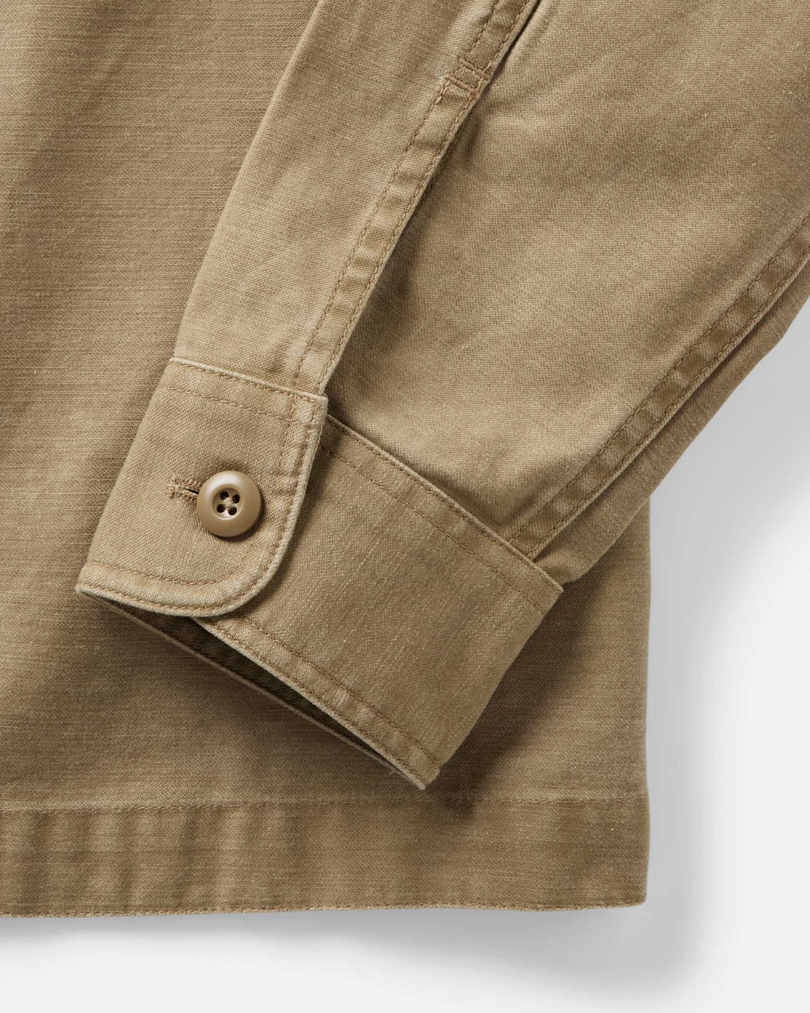 fit model showing off buttons on The Surplus Shirt in Khaki Reverse Sateen, Wovens by Taylor Stitch