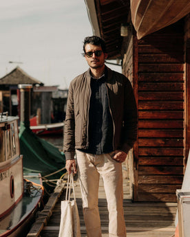 fit model posing in The Able Jacket in Soil Quilted Nylon, Outerwear by Taylor Stitch