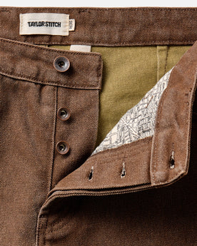 flatlay of The Camp Pant in Aged Penny Chipped Canvas, Bottoms by Taylor Stitch