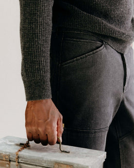 fit model posing in The Chore Pant in Coal Chipped Canvas, Bottoms by Taylor Stitch