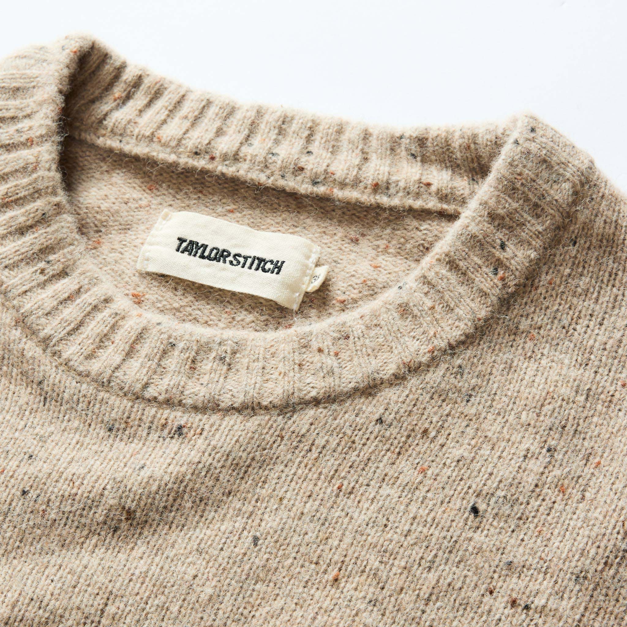 material shot of the collar on The Lodge Sweater in Sand Donegal, Knits by Taylor Stitch