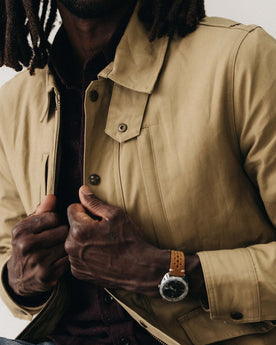 fit model adjusting The Pathfinder Jacket in Khaki Dry Wax, Outerwear by Taylor Stitch
