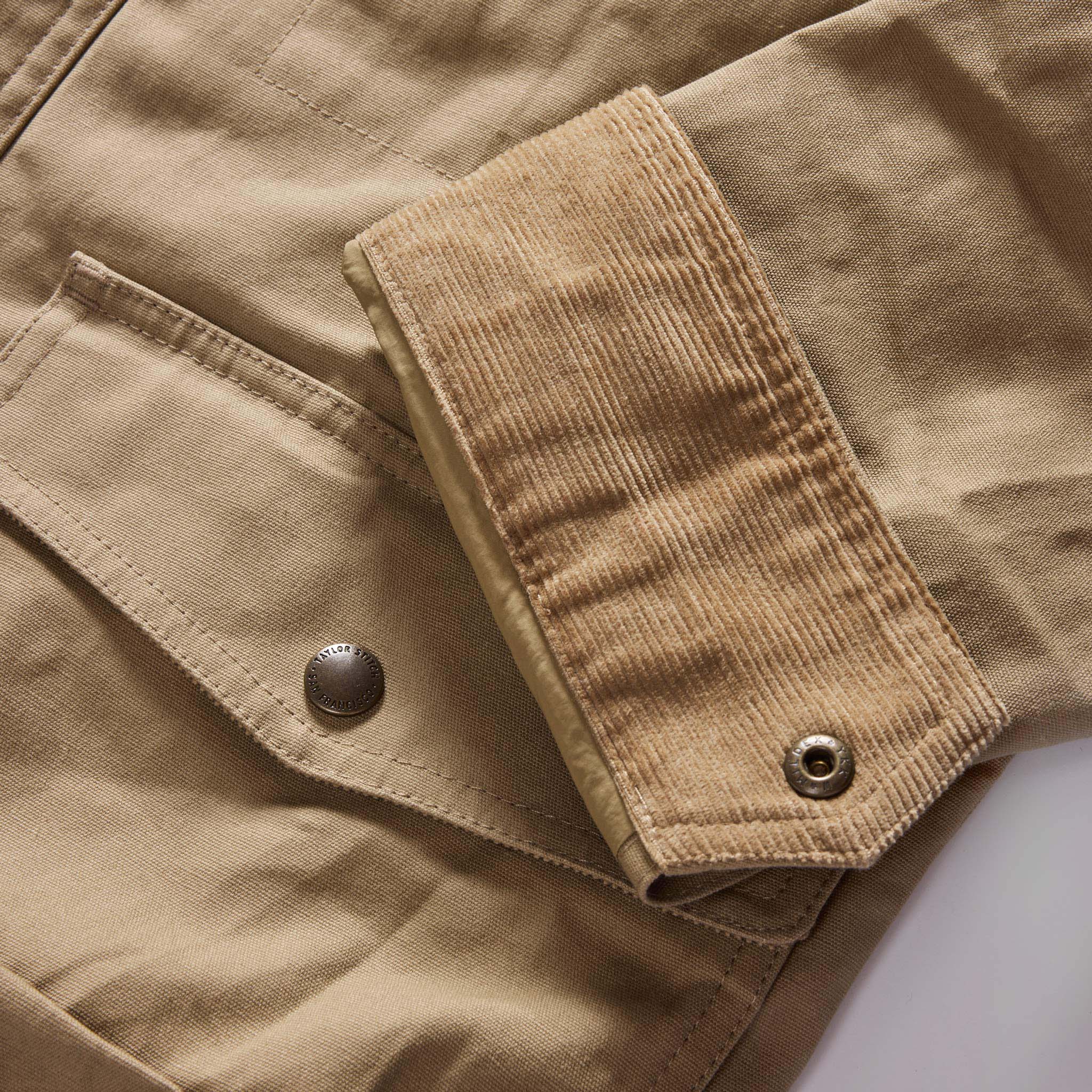 material shot of the cuff on The Pathfinder Jacket in Khaki Dry Wax, Outerwear by Taylor Stitch