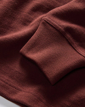 material shot of the sleeves on The Rugby Shirt in Dried Cherry Stripe, Knits by Taylor Stitch