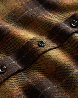 material shot of the buttons on The Yosemite Shirt in Bonfire Plaid, Wovens by Taylor Stitch