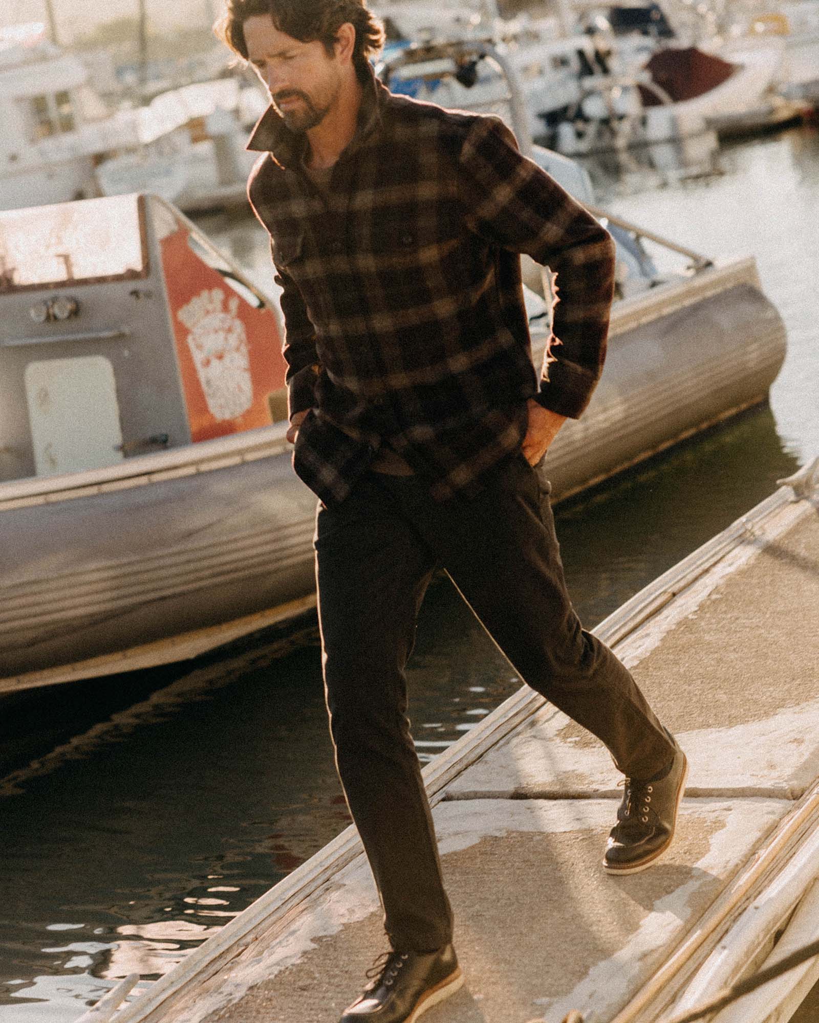 fit model with his hand in his pocket wearing The Democratic Foundation Pant in Organic Faded Black, Bottoms by Taylor Stitch