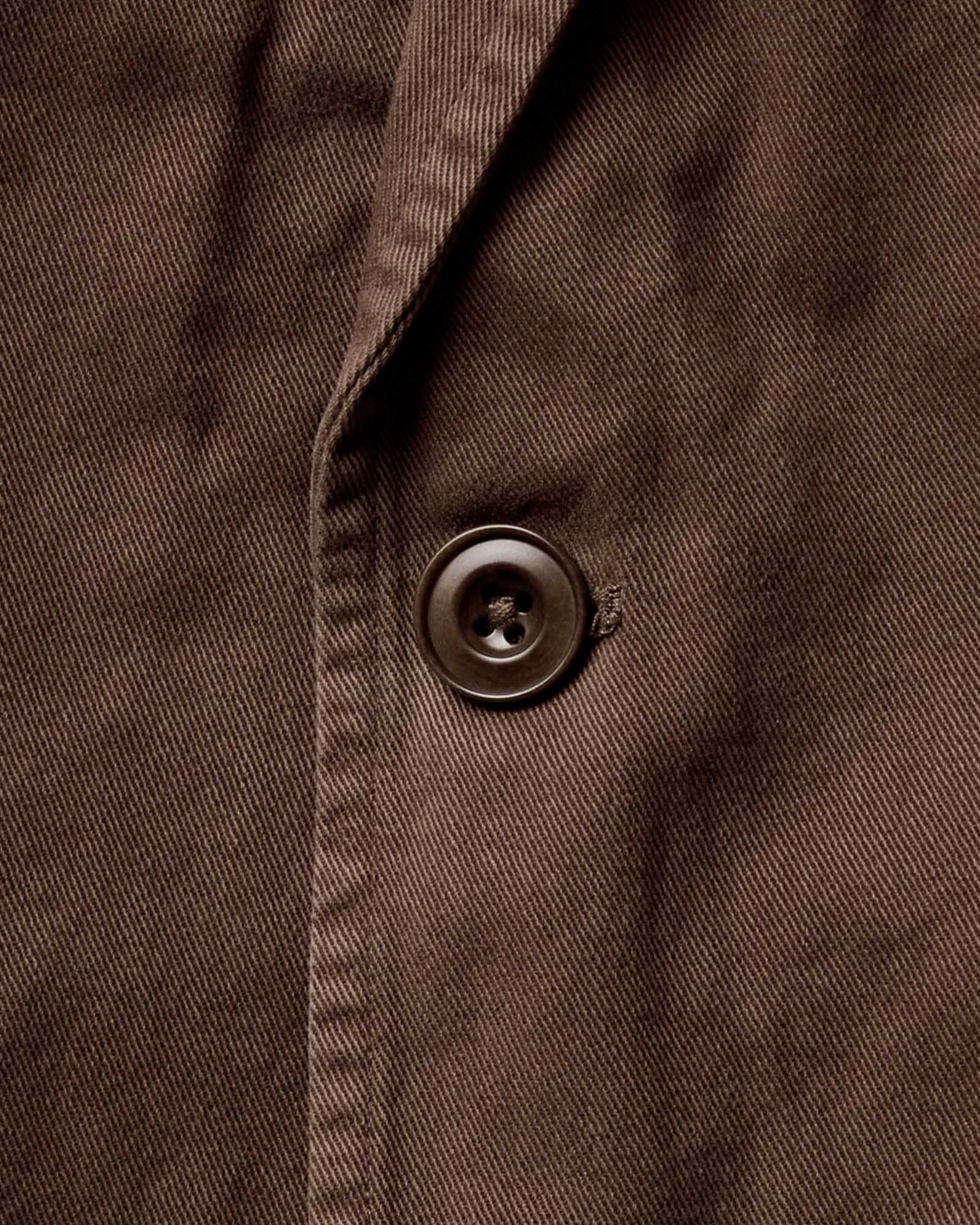 material shot of the button on The Foundation Sportcoat in Organic Espresso Twill, Outerwear by Taylor Stitch