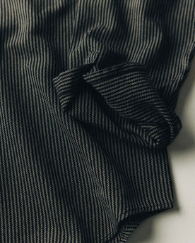 fit model sitting wearing The Jack in Roped Black Indigo, Wovens by Taylor Stitch