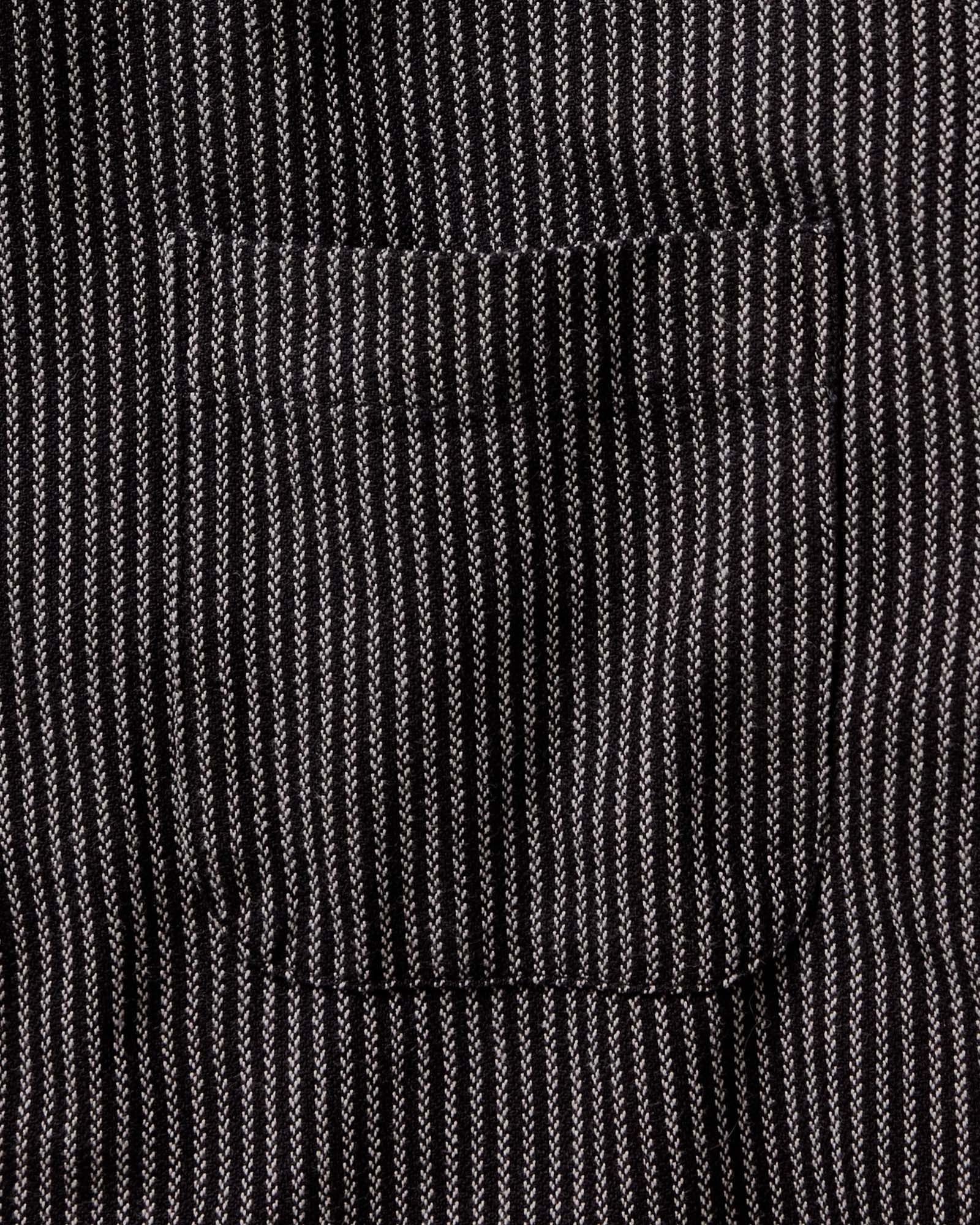 fit model adjusting the cuffs on The Jack in Roped Black Indigo, Wovens by Taylor Stitch