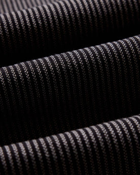 material shot of the back button on the collar on The Jack in Roped Black Indigo, Wovens by Taylor Stitch
