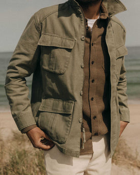 fit model walking wearing The Surplus Jacket in Field Olive Reverse Sateen, Outerwear by Taylor Stitch