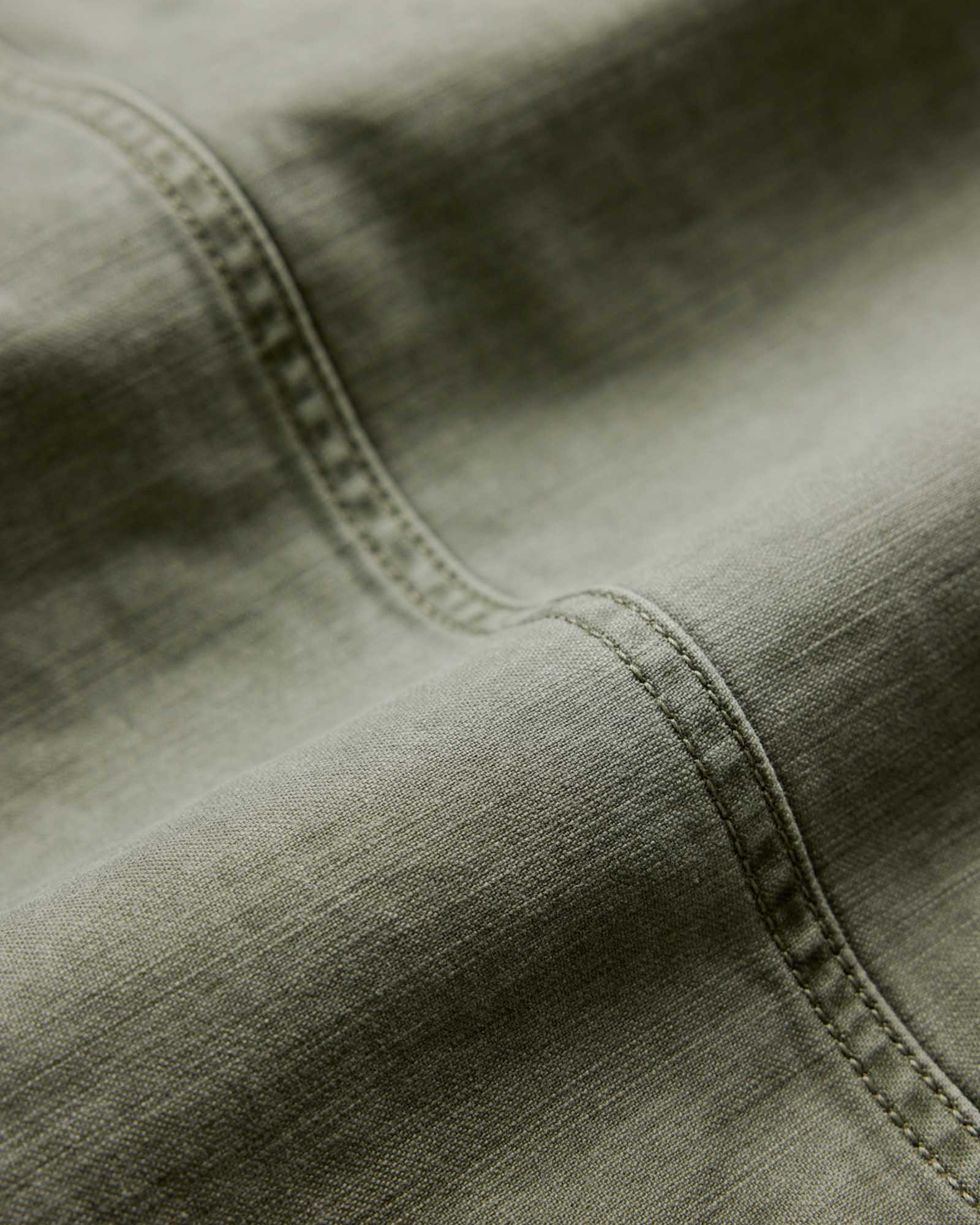 editorial image of the seams on The Surplus Jacket in Field Olive Reverse Sateen, Outerwear by Taylor Stitch