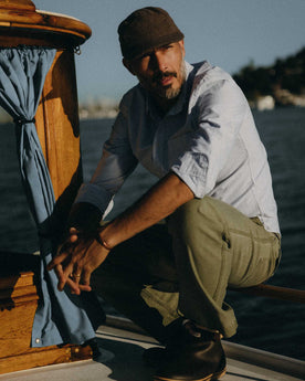 fit model adjusting his collar on The Jack in Navy University Stripe Everyday Oxford, Wovens by Taylor Stitch