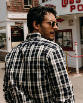 fit model showing off the back of The Jack in Rinsed Indigo Plaid Oxford, Wovens by Taylor Stitch