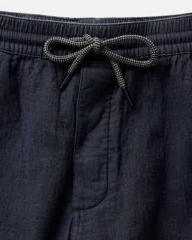 material shot of the waistband on The Apres Pant in Coal Double Cloth, Bottoms by Taylor Stitch
