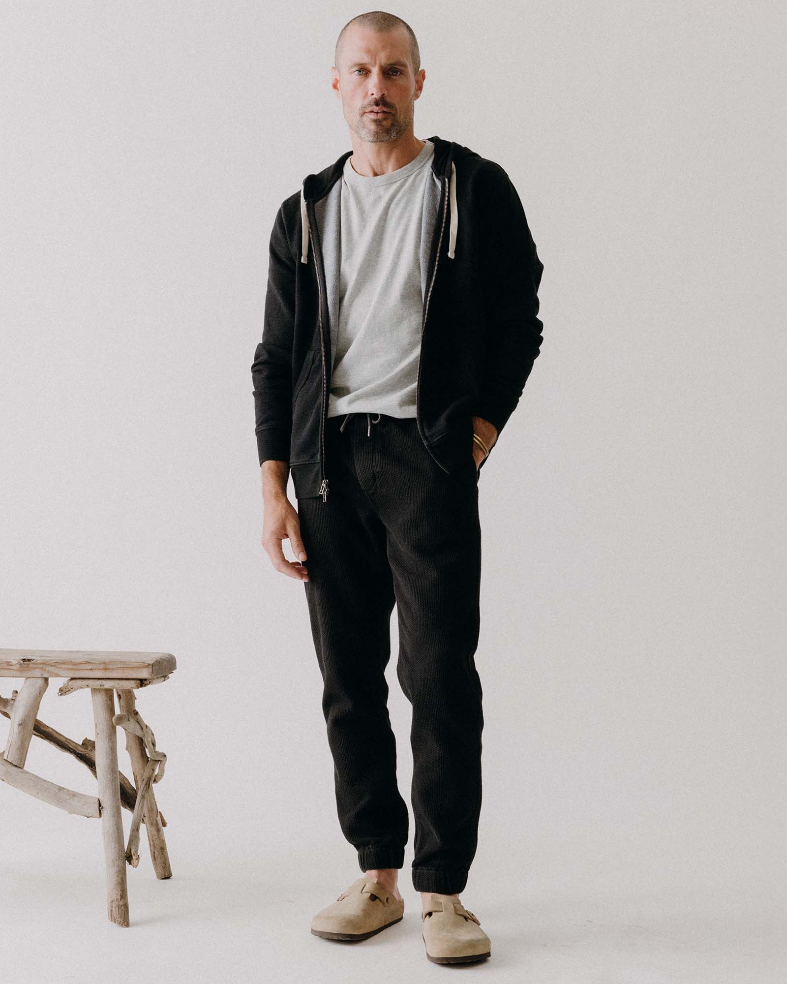 fit model posing in The Apres Pant in Black Indigo Sashiko, Bottoms by Taylor Stitch