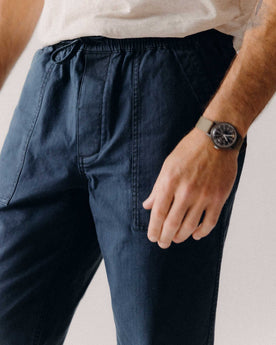 fit model showing off the pockets on The Breakwater Pant in Dark Navy Ripstop, Bottoms by Taylor Stitch