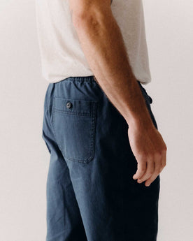 fit model showing off the back pockets on The Breakwater Pant in Dark Navy Ripstop, Bottoms by Taylor Stitch
