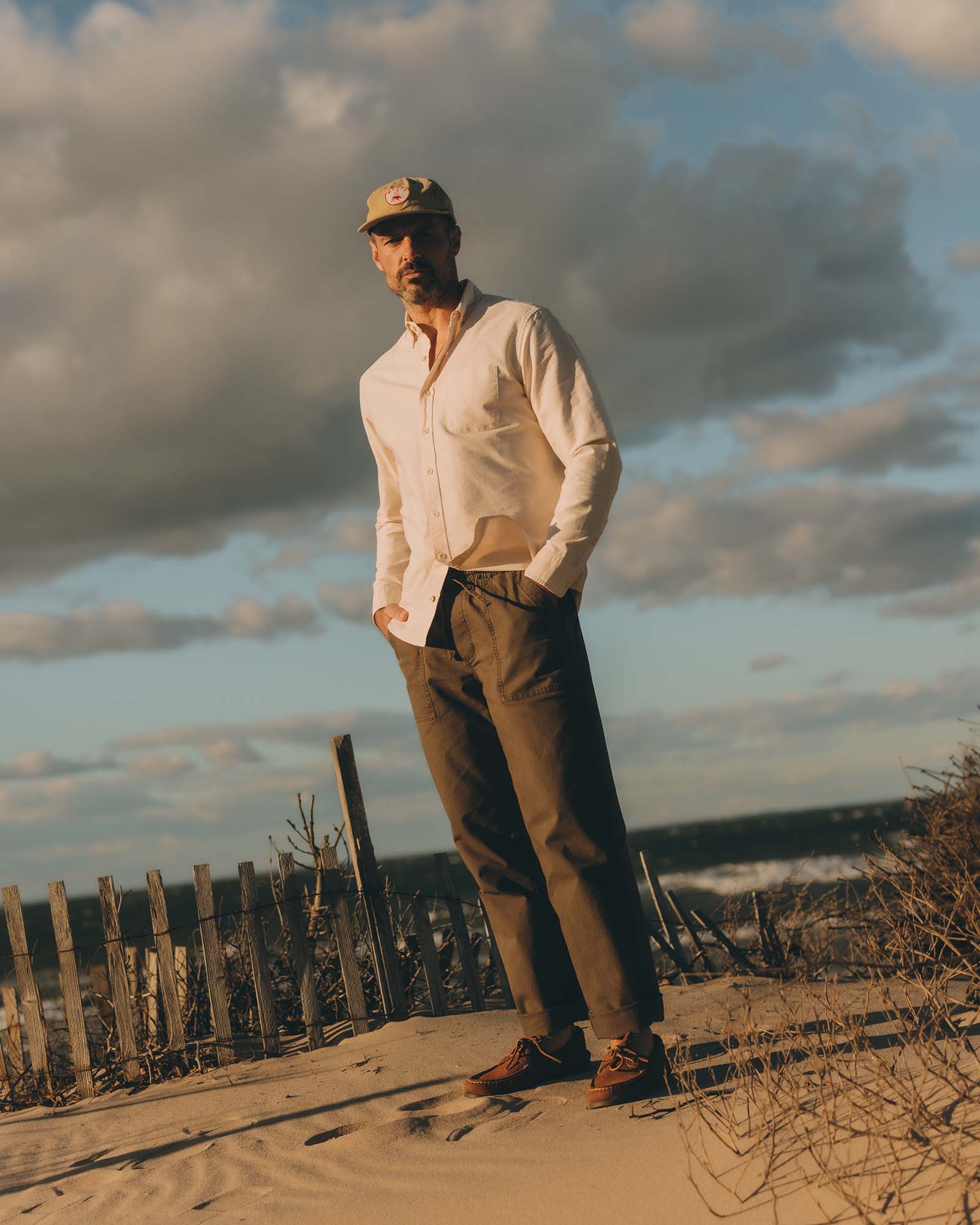 fit model showing off the pockets on The Breakwater Pant in Mushroom Ripstop, Bottoms by Taylor Stitch