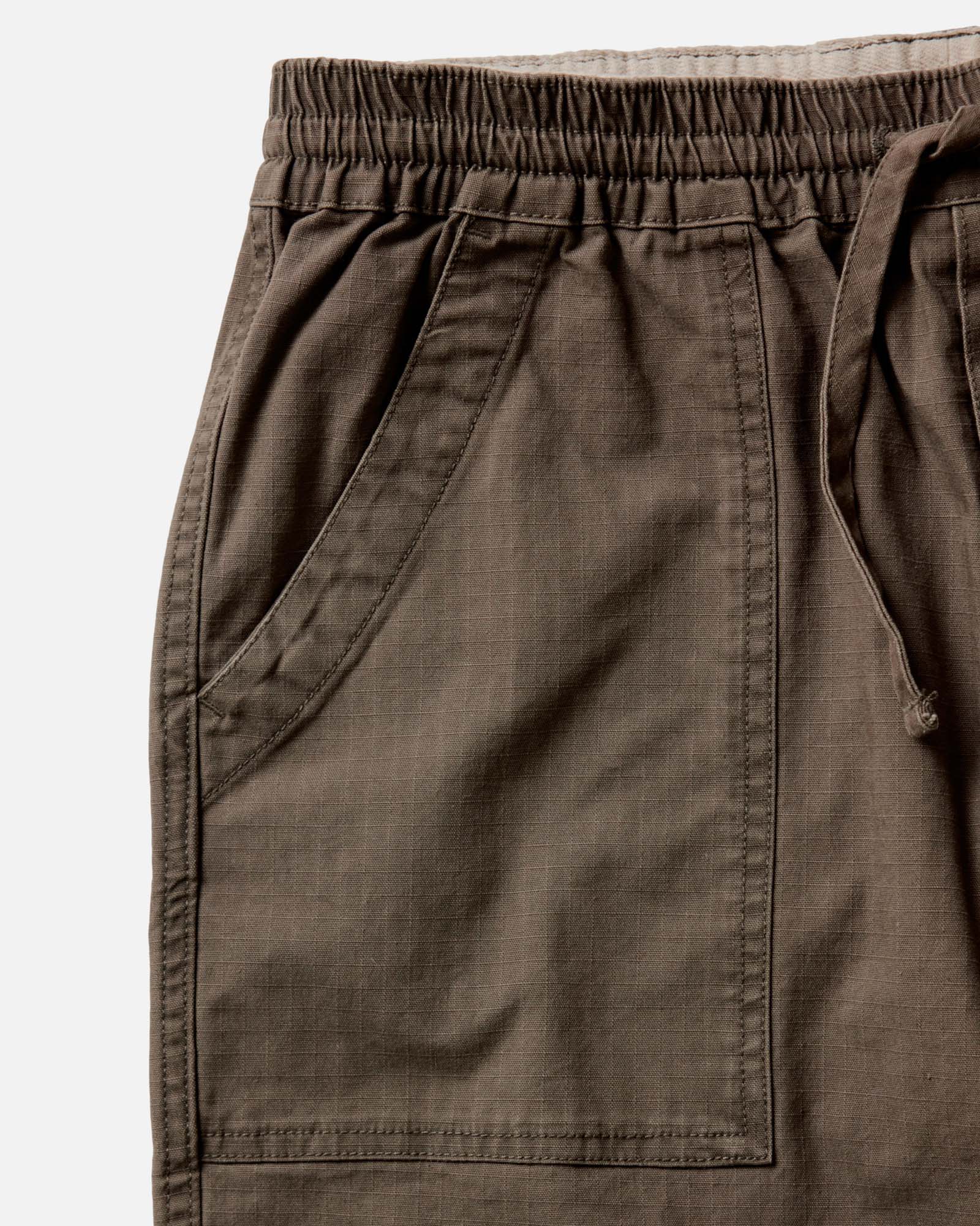 fit model walking in The Breakwater Pant in Mushroom Ripstop, Bottoms by Taylor Stitch