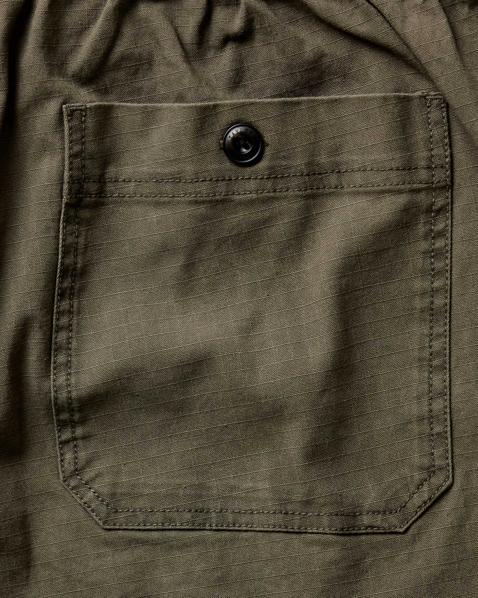 material shot of the back pocket on The Breakwater Pant in Mushroom Ripstop, Bottoms by Taylor Stitch