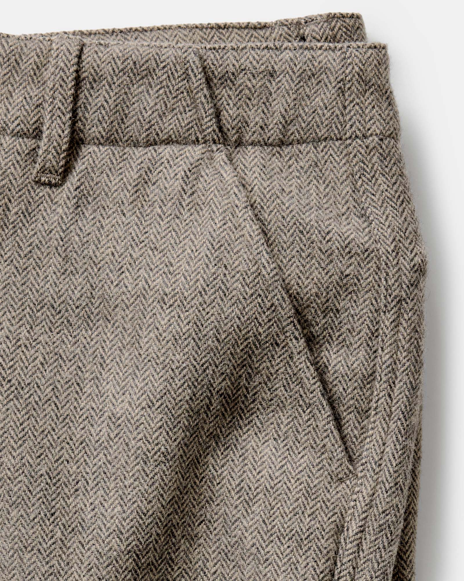 material shot of the pocket on The Carnegie Pant in Gravel Herringbone Wool, Bottoms by Taylor Stitch