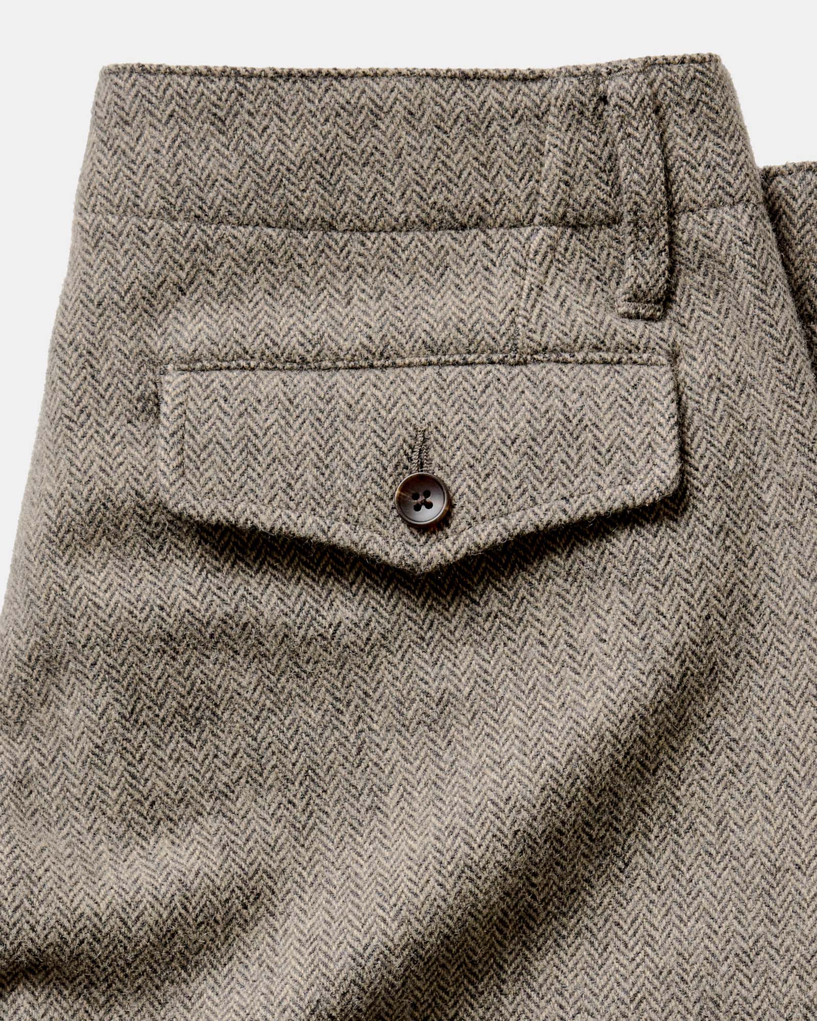 material shot of the back pocket on The Carnegie Pant in Gravel Herringbone Wool, Bottoms by Taylor Stitch