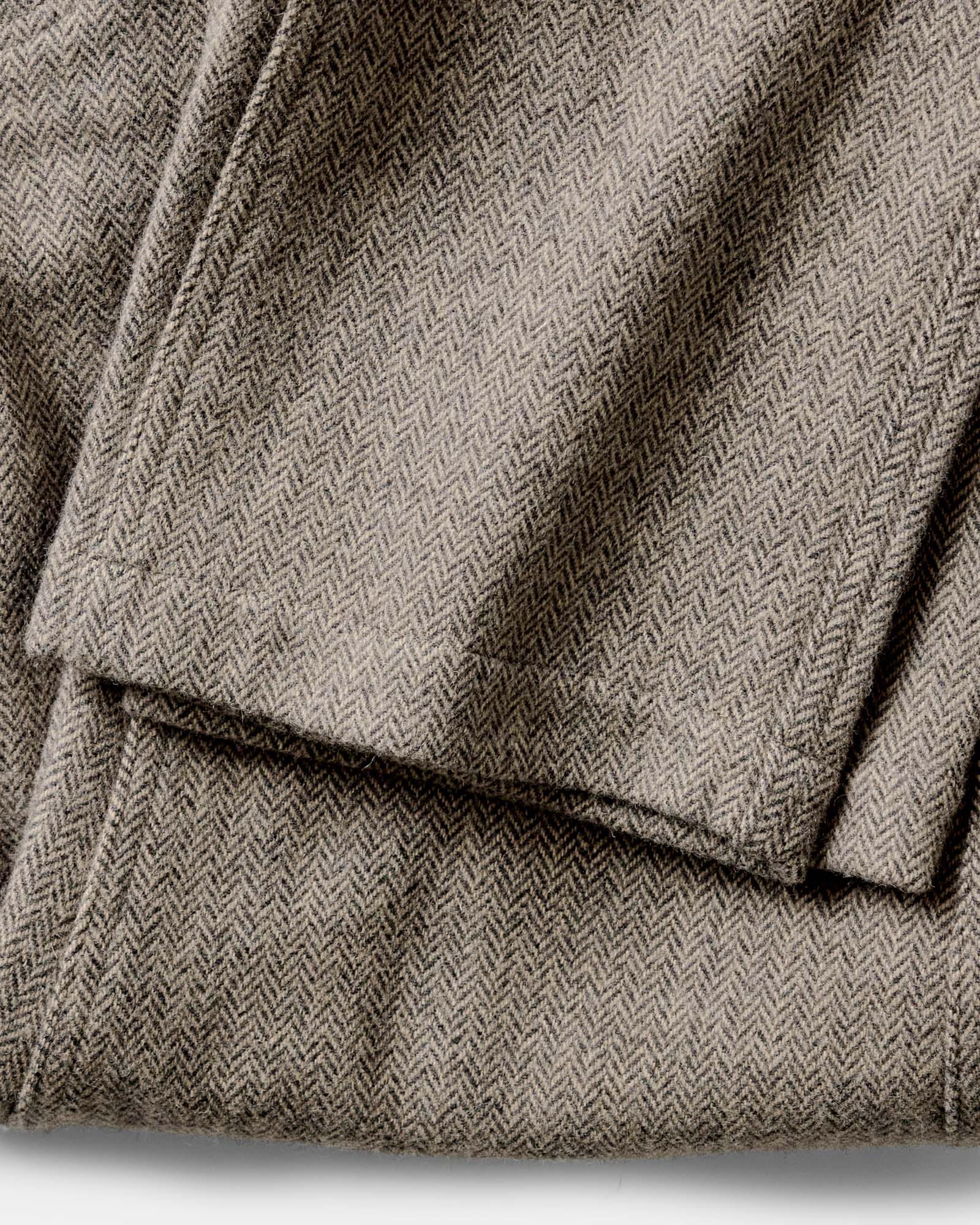 material shot of the hem on The Carnegie Pant in Gravel Herringbone Wool, Bottoms by Taylor Stitch