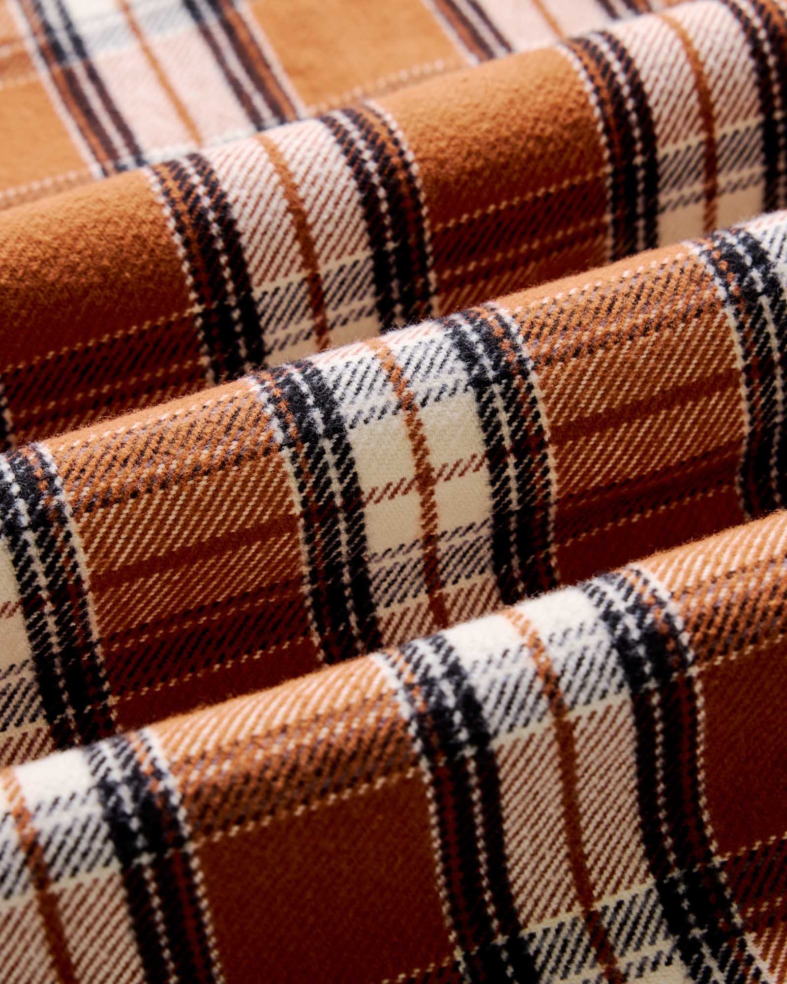 material shot of the fabric on The Crater Shirt in Brick Plaid, Wovens by Taylor Stitch