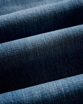 material shot of the fabric on The Democratic Jean in Mid Wash Organic Selvedge, Bottoms by Taylor Stitch