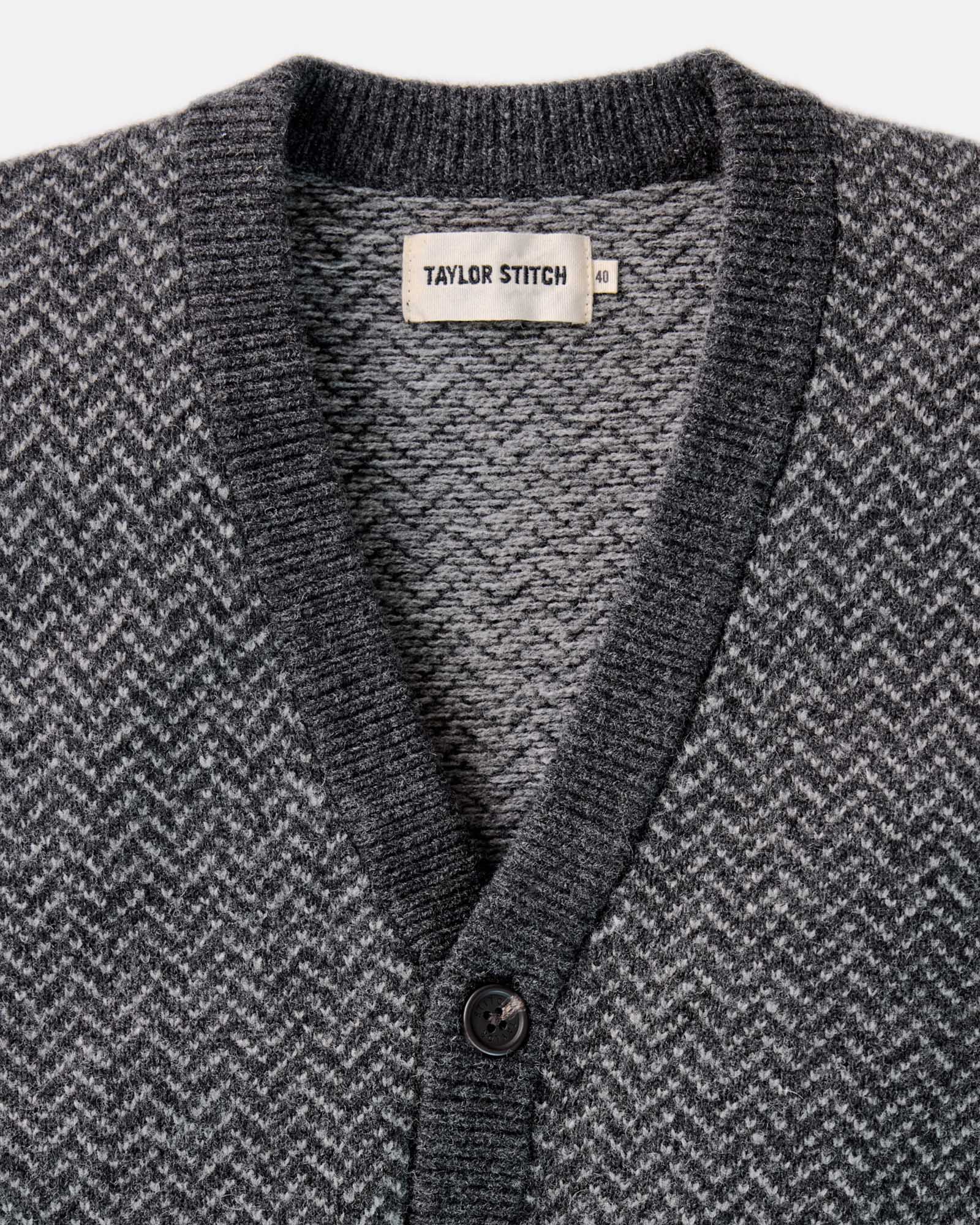 material shot of the collar on The Eddy Cardigan in Heather Charcoal Herringbone, Knits by Taylor Stitch
