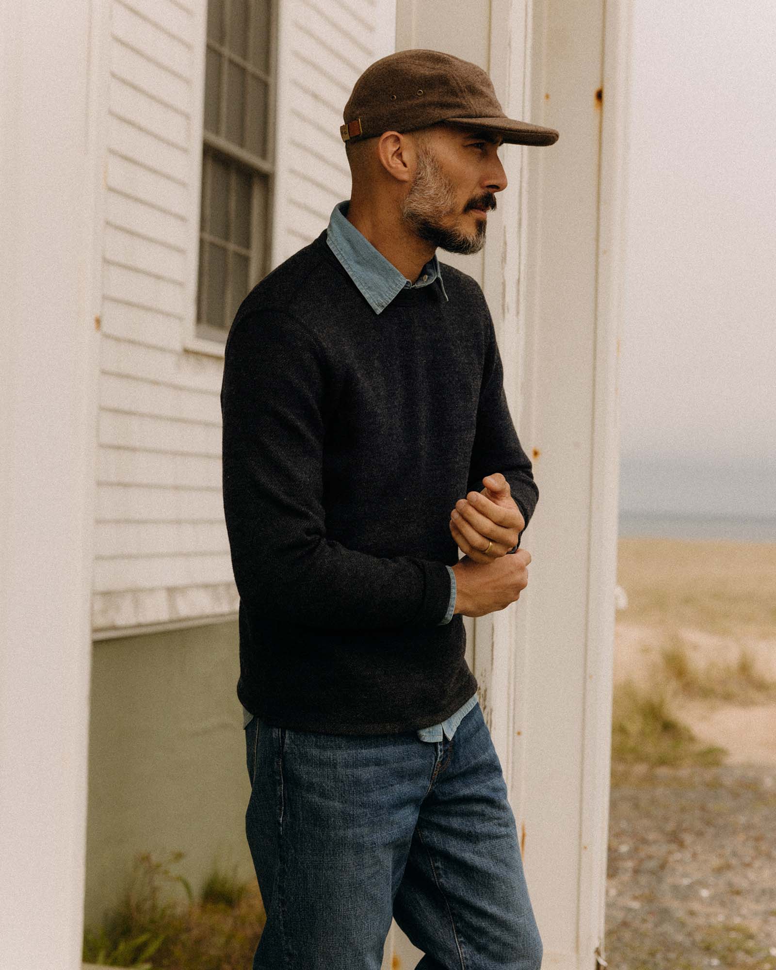 fit model posing in The Evans Crew in Navy Birdseye Wool, Knits by Taylor Stitch