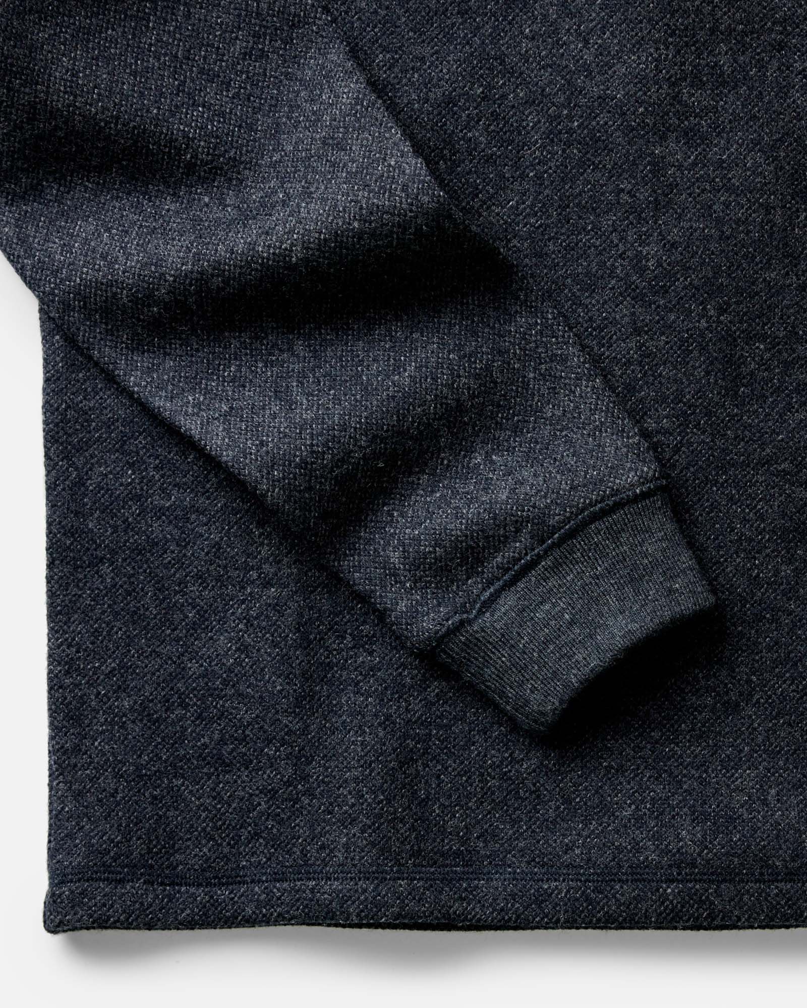 material shot of the sleeves on The Evans Crew in Navy Birdseye Wool, Knits by Taylor Stitch