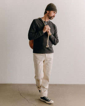 fit model posing in The Evans Henley in Charcoal Birdseye Wool, Knits by Taylor Stitch