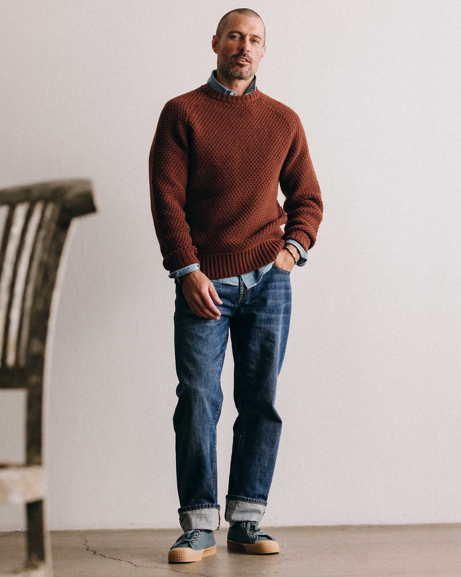 fit model posing in The Fisherman Sweater in Heather Brick Merino, Knits by Taylor Stitch