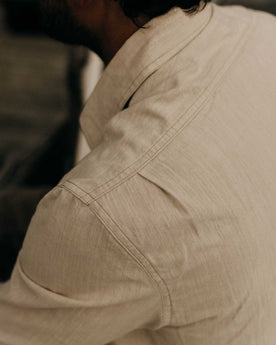 fit model showing off the back of The Foundry Shirt in Natural Chambray, Wovens by Taylor Stitch