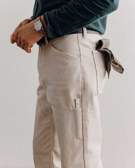 fit model posing in The Good Acre Chore Pant in Natural Canvas, Bottoms by Taylor Stitch