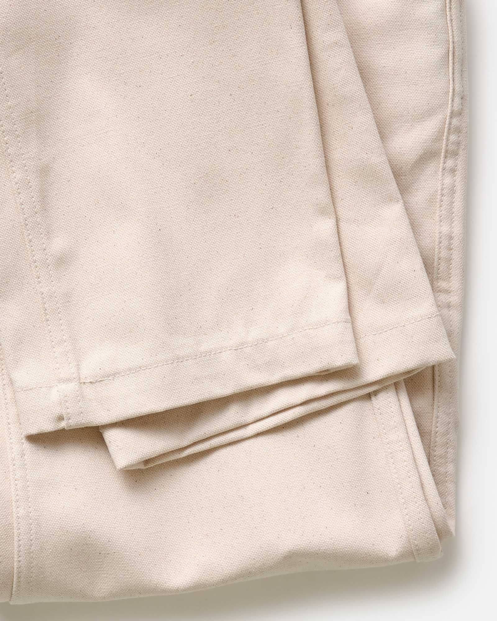 material shot of the cuffs on The Good Acre Chore Pant in Natural Canvas, Bottoms by Taylor Stitch