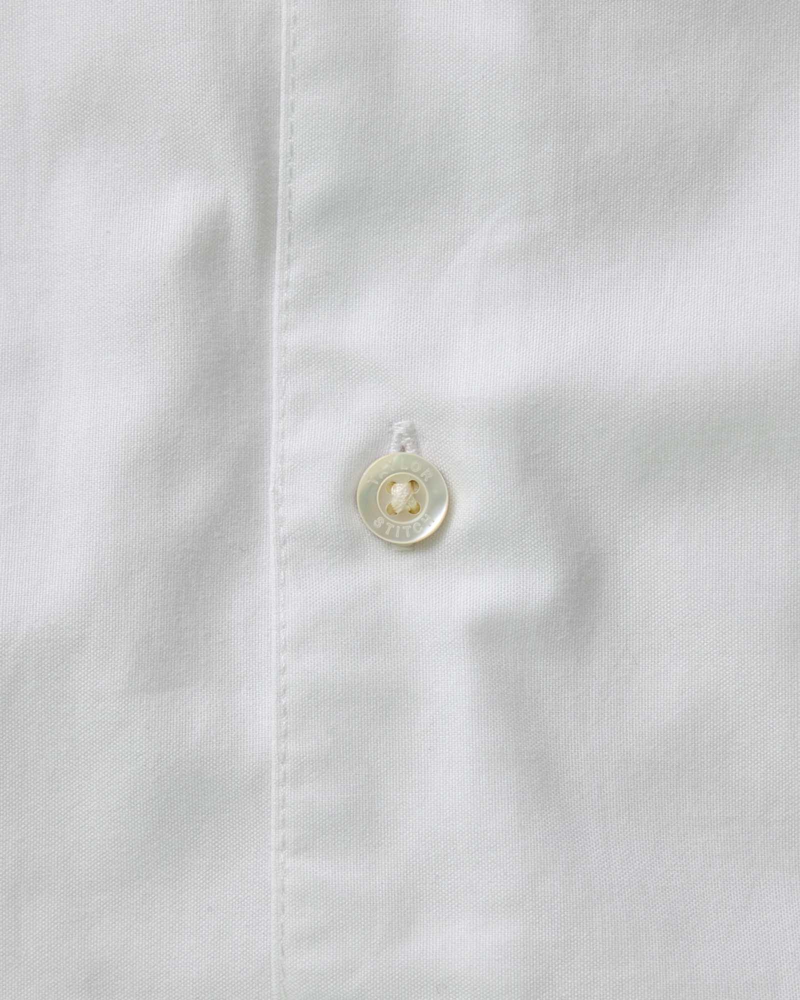 material shot of the button on The Hyde Shirt in White Pinpoint Oxford, Wovens by Taylor Stitch