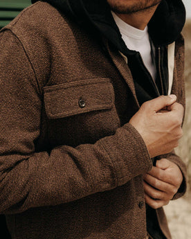 fit model showing off the pocket on The Ledge Shirt in Black Coffee Linen Tweed, Wovens by Taylor Stitch