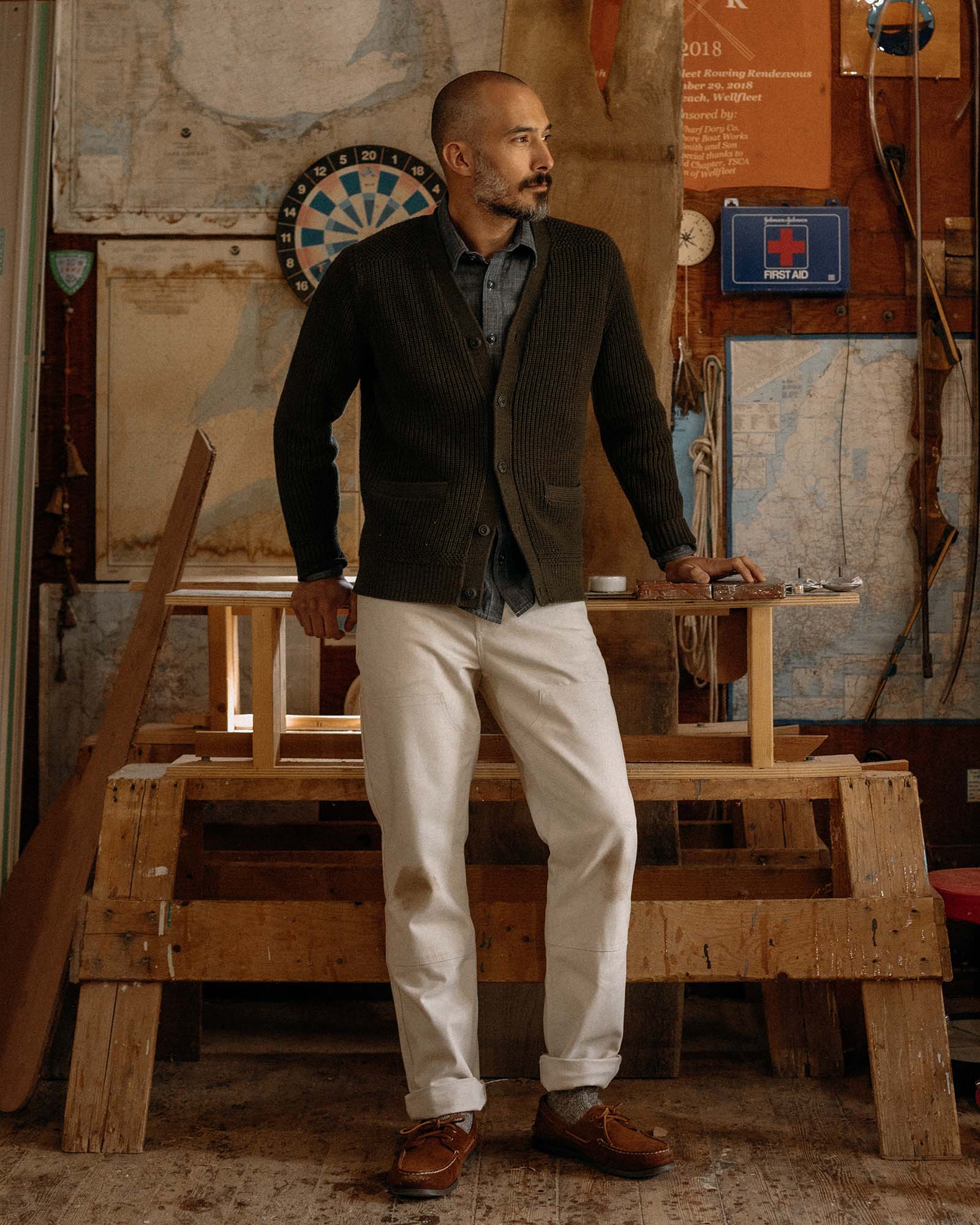 fit model posing in The Mariner Cardigan in Heather Loden Slub, Knits by Taylor Stitch