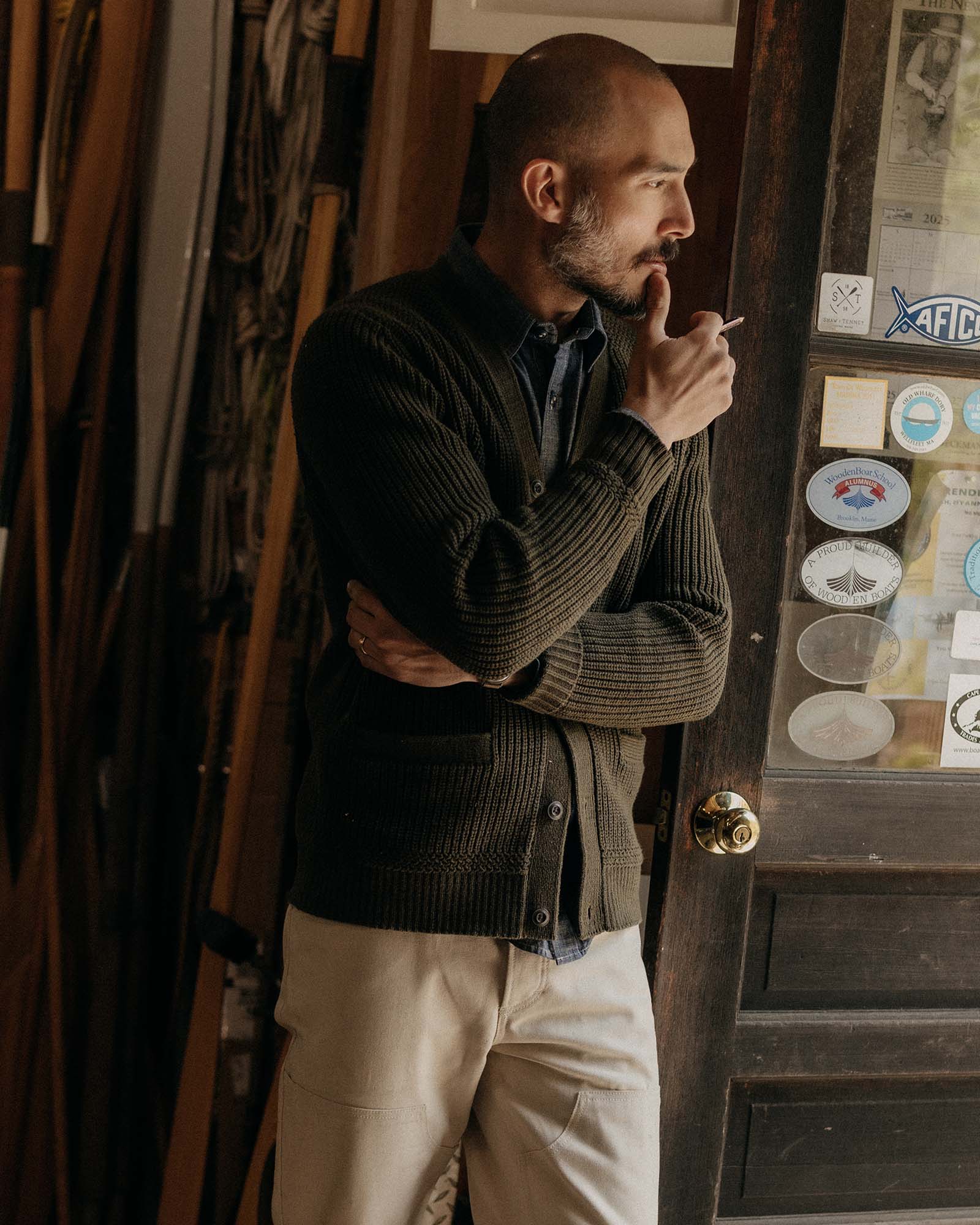 fit model posing in The Mariner Cardigan in Heather Loden Slub, Knits by Taylor Stitch