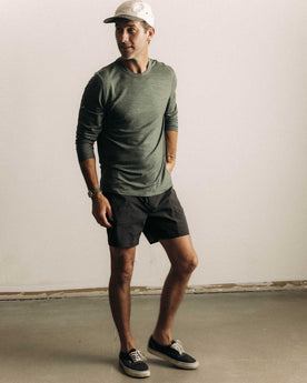 fit model showing off The Merino Long Sleeve Tee in Heather Army, Knits by Taylor Stitch