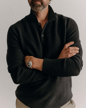 fit model posing in The Newton Sweater Polo in Midnight Merino, Knits by Taylor Stitch