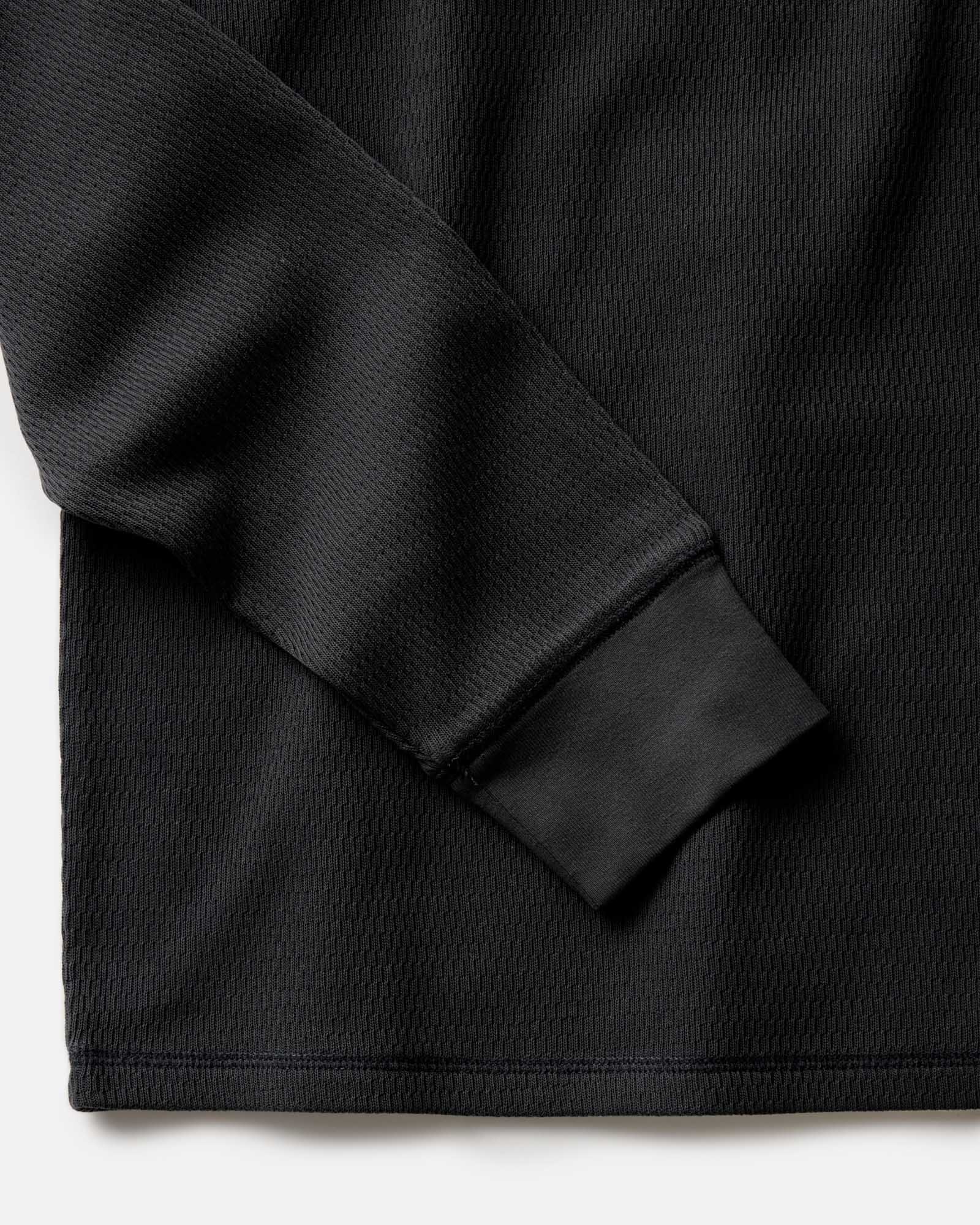 material shot of the sleeve on The Organic Cotton Crew in Faded Black Waffle, Knits by Taylor Stitch