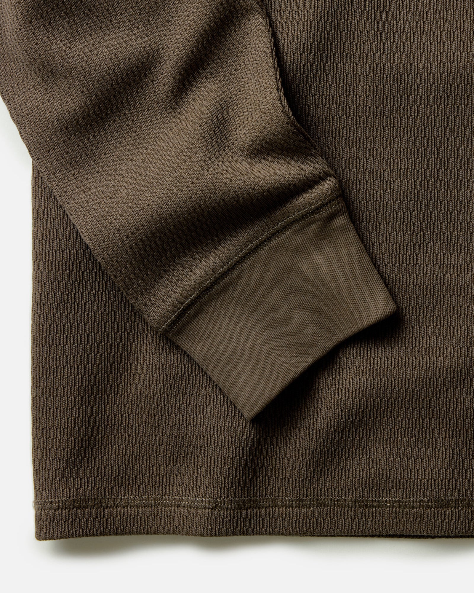 material shot of the sleeves on The Organic Cotton Crew in Fatigue Olive Waffle, Knits by Taylor Stitch