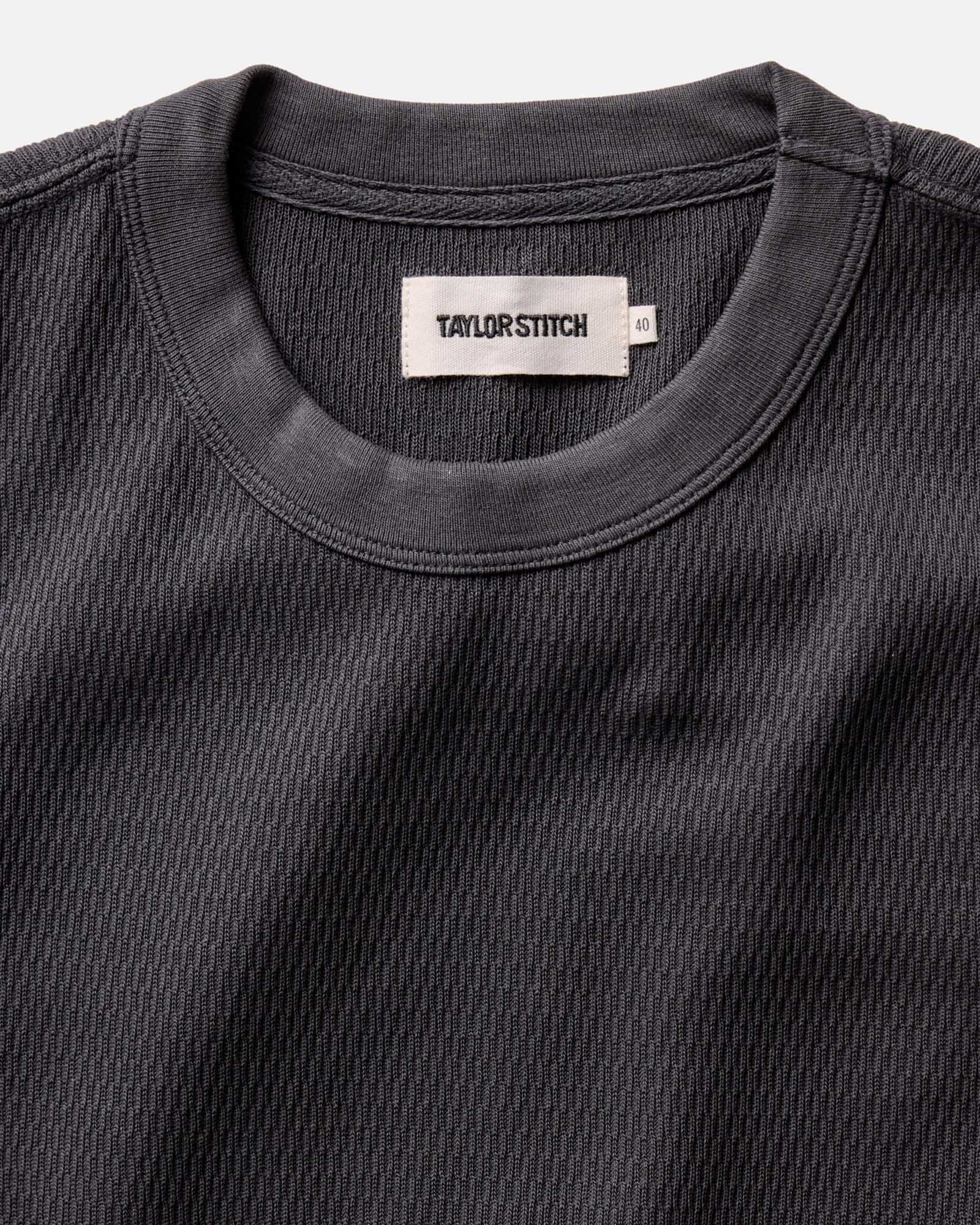 material shot of the neck opening of The Organic Cotton Short Sleeve Crew in Faded Black Waffle, Knits by Taylor Stitch